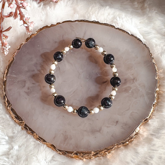 Anneau de bola avec perles d’obsidienne et nacre